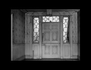 Interior showcasing a dutch colonial style door with door mouldings, window designs, and wall mouldings.