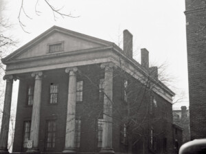 Campbell-Whittlesey house with big columns, side steps to entrance, brick chimney, exterior cornice mouldings, and window mouldings and casings.