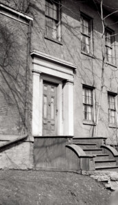 Campbell-Whittlesey house doorway with column mouldings, panel molds, casing, and steps to entrance.