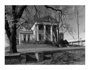 Hervey Ely house features large columns, window mouldings, and brick chimneys.