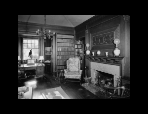 Interior of colonial revival style home featuring interior cornice, window mouldings, fireplace mouldings, and rectangle wall mouldings.