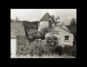 French country style castle top exterior with window mouldings.