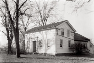 Clark Pratt Kernery house exterior featuring shingle siding, door casing mouldings, window casing mouldings, and cornice mouldings.