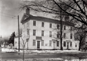 Exterior of Columbian House featuring shingle siding, window casing mouldings, cornice mouldings, and doorway mouldings.