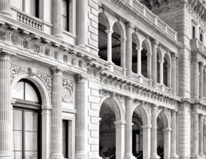 Close up of an italian renaissance style castle featuring balconies, columns, cornice mouldings, and window mouldings.