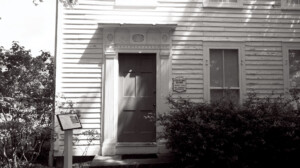 Exterior of Chester Moffett House door featuring shingle siding.