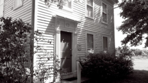 Exterior of Chester Moffett House door featuring window mouldings.