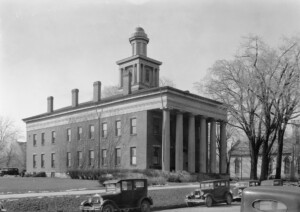 Exterior of Sandusky County Court House north elevation featuring tall windows with shutters, chimneys on roof and large cupola on roof