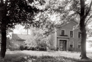 Exterior of Sweet House featuring triangular roof, tall windows, door casing with mouldings and door casing with panel molds