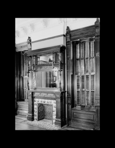 Interior of Victorian style room with fireplace mouldings, and cabinetry mouldings.