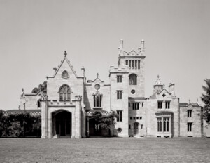 Gothic Revival style castle with pointed arches, large stained glass windows, ribbed vaults, and ornate decoration.