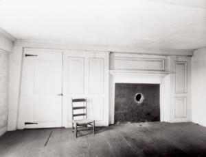 Interior of Benjamin Abbott Farmhouse featuring door casing mouldings with panel molds, and interior fireplace mantel mouldings.